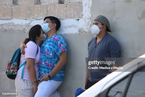 Couple of nurses hug as health department opens 300 nursing jobs on August 4, 2020 in Cancun, Mexico. 1000 nursing specialists went to the Training...