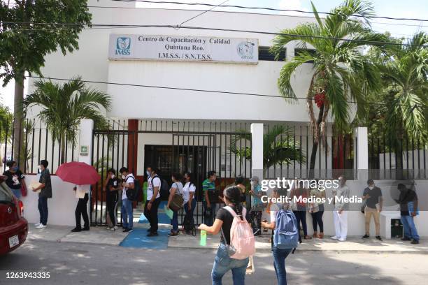 People line up as health department opens 300 nursing jobs on August 4, 2020 in Cancun, Mexico. 1000 nursing specialists went to the Training and...