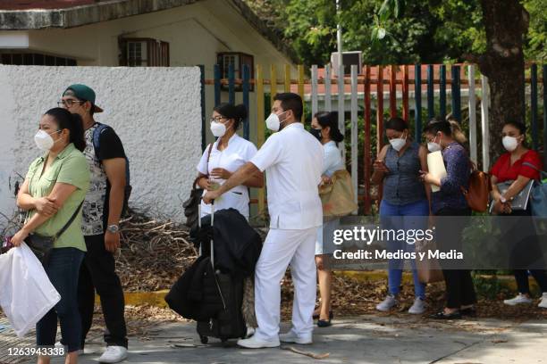 People line up as health department opens 300 nursing jobs on August 4, 2020 in Cancun, Mexico. 1000 nursing specialists went to the Training and...