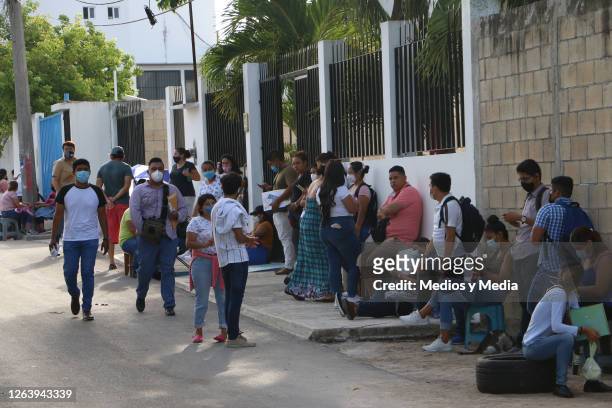 People line up as health department opens 300 nursing jobs on August 4, 2020 in Cancun, Mexico. 1000 nursing specialists went to the Training and...