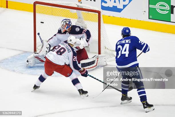 Auston Matthews of the Toronto Maple Leafs scores a goal past Joonas Korpisalo of the Columbus Blue Jackets during the second period in Game Two of...