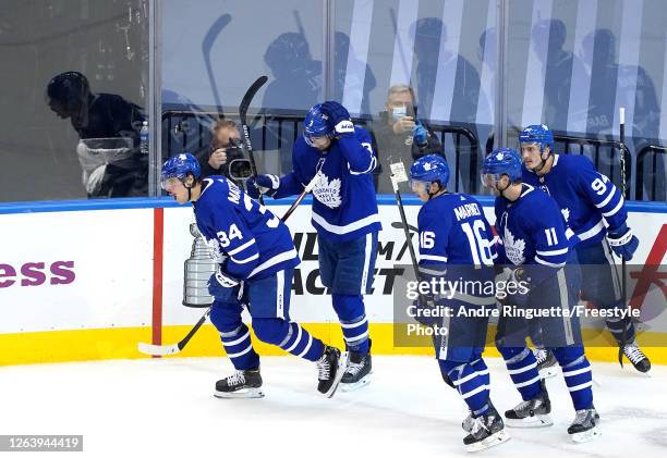 Auston Matthews of the Toronto Maple Leafs celebrates with his teammates after scoring a goal against the Columbus Blue Jackets during the second...