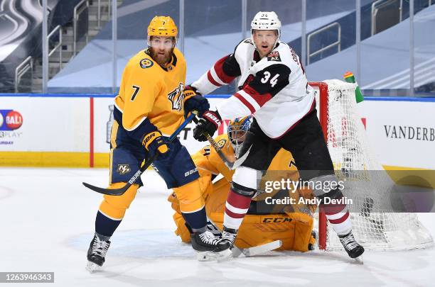 Carl Soderberg of the Arizona Coyotes and Yannick Weber of the Nashville Predators vie for position in the first period of Game Two of the Western...
