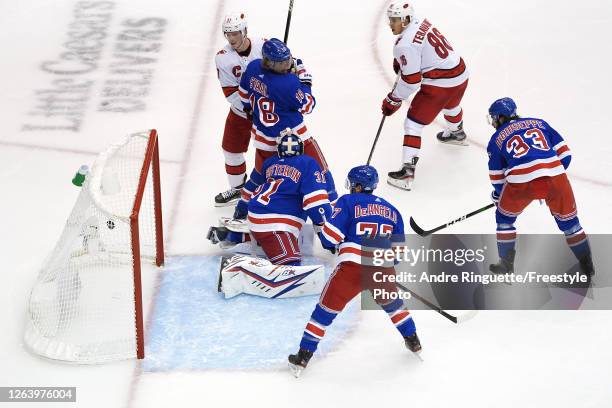 Teuvo Teravainen of the Carolina Hurricanes scores a goal on Igor Shesterkin of the New York Rangers during the second period in Game Three of the...