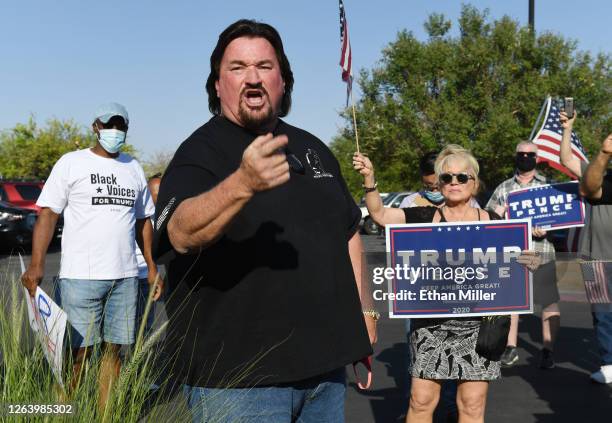 Nevada Republican Party Chairman Michael McDonald speaks to people gathered to protest against the passage of a mail-in voting bill during a Nevada...