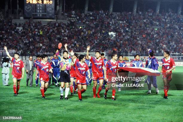 Kashima Antlers players and staffs lap the stadium as they celebrate Suntory Series Champions after the J.League Suntory Series match between Kashima...