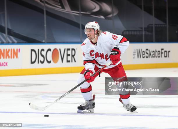 Sami Vatanen of the Carolina Hurricanes controls the puck in the first period of Game Three of the Eastern Conference Qualification Round against the...