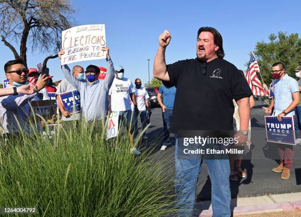 Nevada Republican Party Chairman Michael McDonald speaks to people gathered to protest against the passage of a mail-in voting bill during a Nevada...