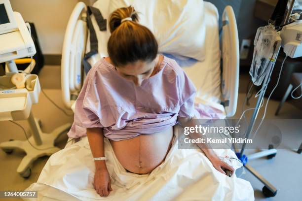 young pregnant woman in the hospital ward and ready to delivery a baby. - american born stock pictures, royalty-free photos & images