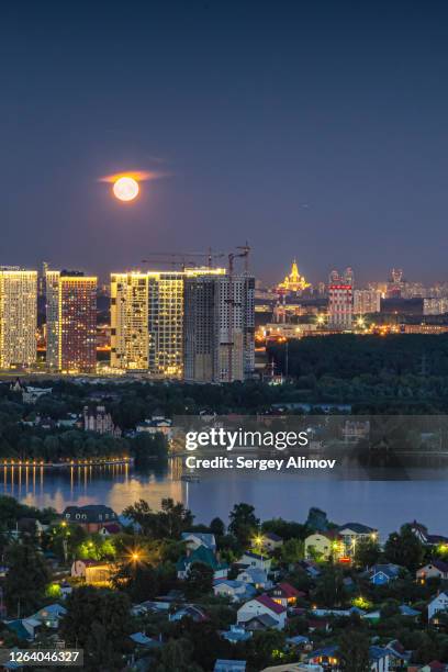 cityscape of night moscow illuminated by full moon - krasnogorsky district moscow oblast stock pictures, royalty-free photos & images