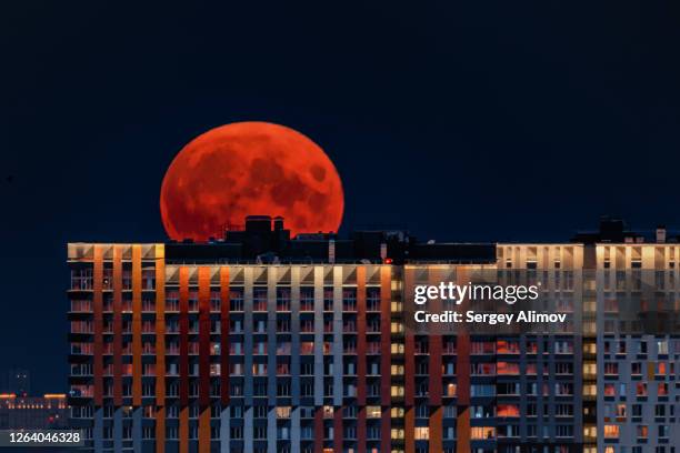 full moon rising over moscow skyline - russia skyline stock pictures, royalty-free photos & images