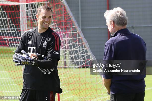 Manuel Neuer of FC Bayern Muenchen talks to Sepp Maier during a training session at Saebener Strasse training ground on August 05, 2020 in Munich,...