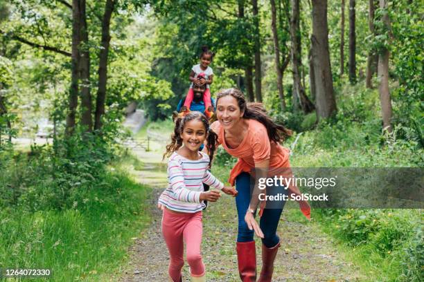 try and catch me mummy! - chasing perfection stock pictures, royalty-free photos & images