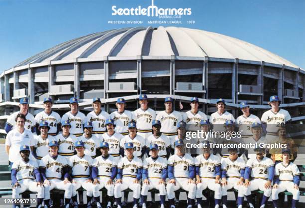 Official team portrait of members of the Seattle Mariners baseball team as they pose outside the Kingdome stadium, Seattle, Washington, 1983.