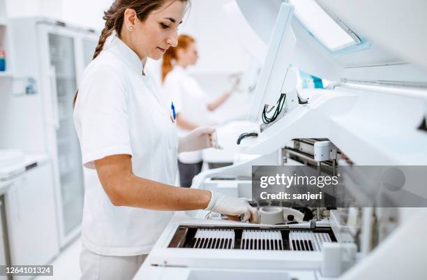 scientists working in the laboratory - machine movement stock pictures, royalty-free photos & images