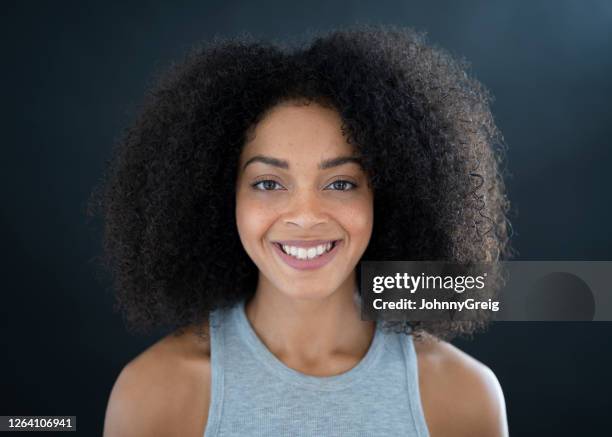 portrait of 23 year old mixed race woman in sleeveless top - heather grey stock pictures, royalty-free photos & images