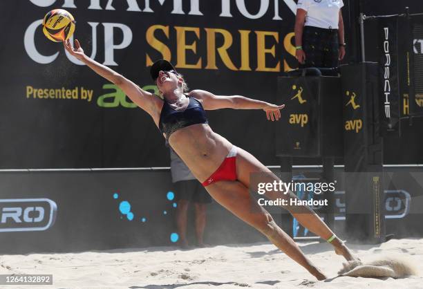 In this handout image provided by AVP, April Ross competes in the final against Kelly Claes and Sarah Sponcil during the Porsche Cup on August 02,...