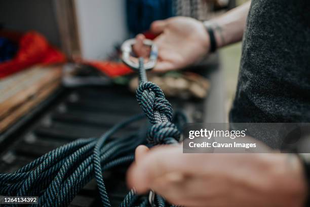 selective focus of knots in climbing rope - mountain climbing equipment stock pictures, royalty-free photos & images