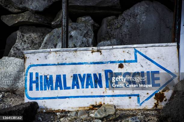 a rescue sign near the trail to everest base camp in nepal. - wilderness font stock pictures, royalty-free photos & images