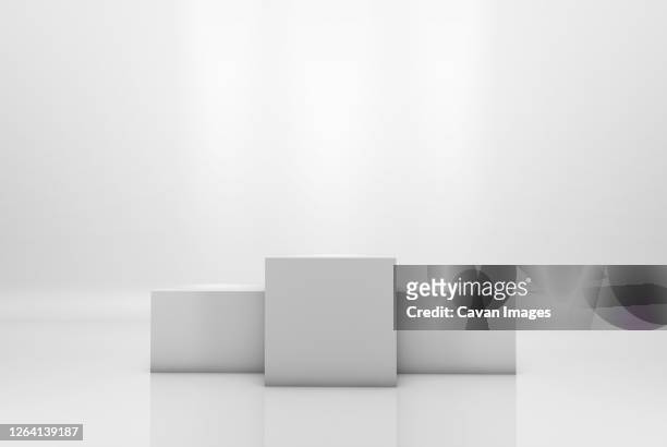 winning podium on white illuminated background - winners podium foto e immagini stock