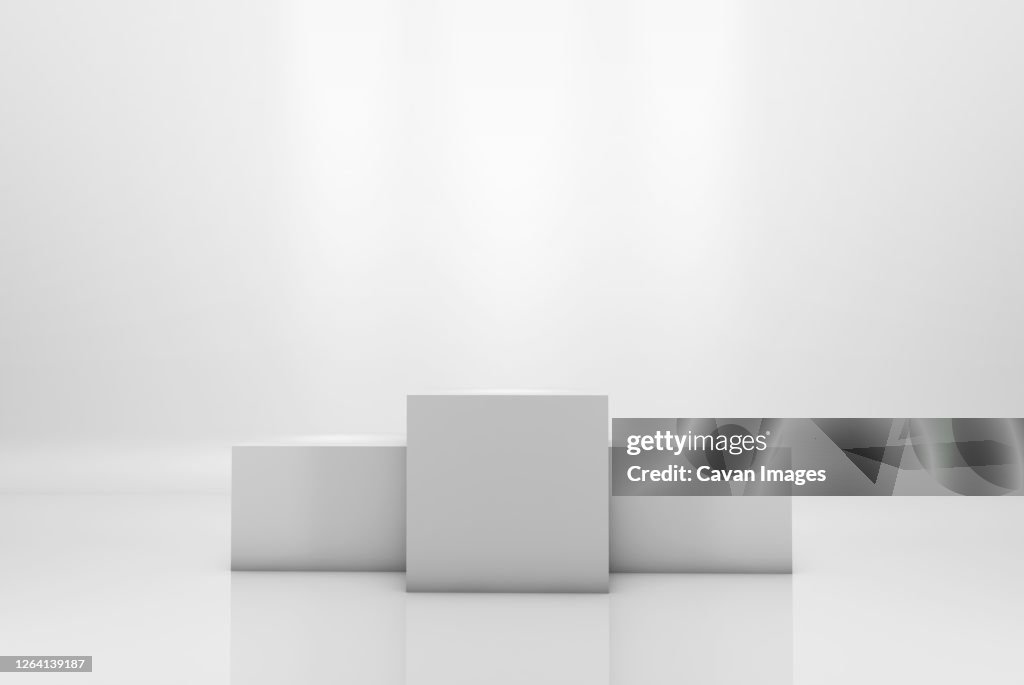 Winning podium on white illuminated background