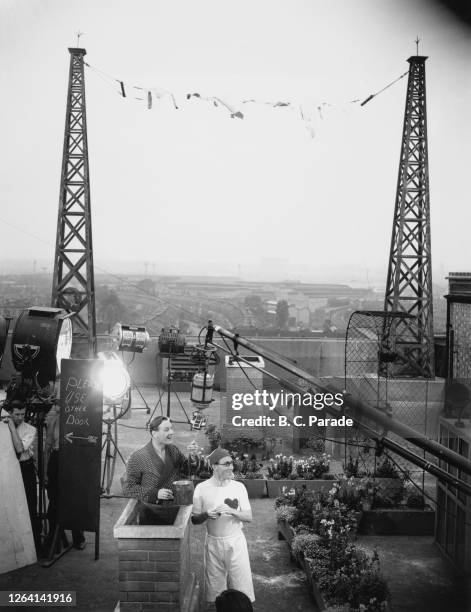 British actor Richard Murdoch and British comedian Arthur Askey during production on the film version of their BBC Radio series 'Band Waggon' at the...
