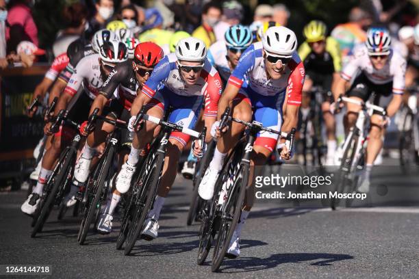 Arnaud Demare of Groupama- FDJ in second place is lead by team mate Jacopo Guarnieri into the final corner before overtaking to ride to victory and...