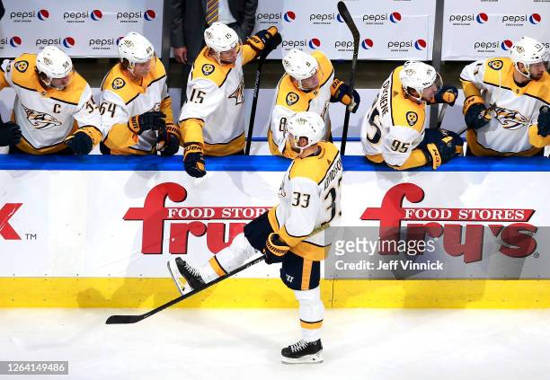 Viktor Arvidsson of the Nashville Predators celebrates his goal with teammates on the bench in the second period against the Arizona Coyotes in Game...