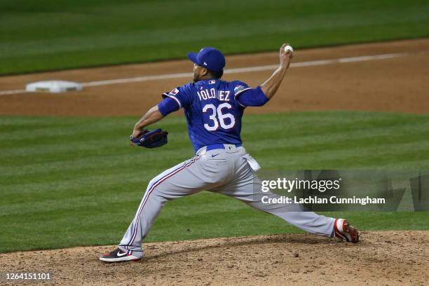 Edinson Volquez of the Texas Rangers pitches in the bottom of the ninth inning against the Oakland Athletics at Oakland-Alameda County Coliseum on...