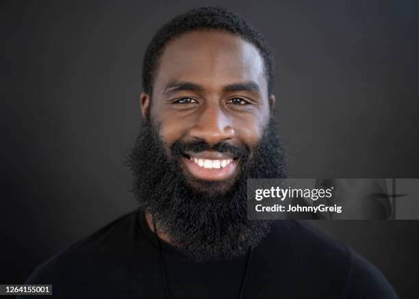 portrait of 31 year old black man with full beard - guy with scar stock pictures, royalty-free photos & images