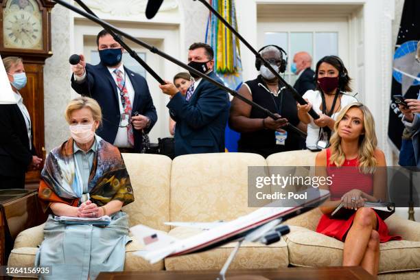 Dr. Deborah Birx , White House coronavirus response coordinator, and White House Press Secretary Kayleigh McEnany , look on as President Donald Trump...