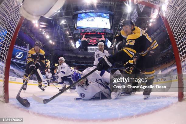 Chris Wagner of the Boston Bruins plays the puck on his back hand and shoots it into the net for a goal in the third period of a Round Robin game...