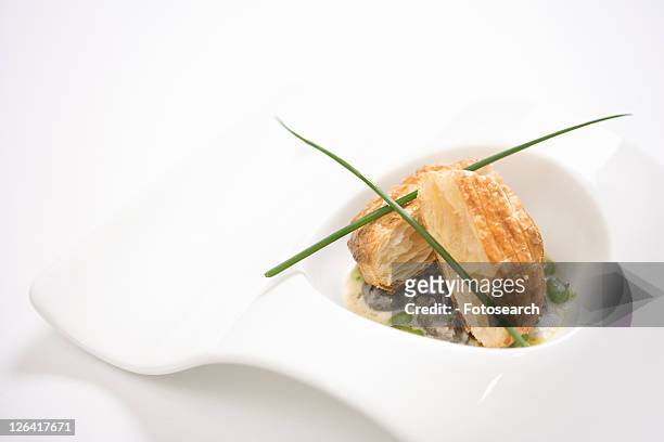 escargot en croute with butter and fava beans. - aliment en portion stock pictures, royalty-free photos & images