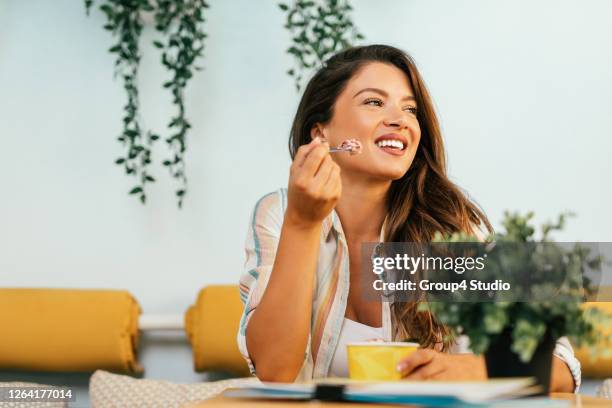 happy young woman enjoying in rolled ice cream - woman ice cream stock pictures, royalty-free photos & images