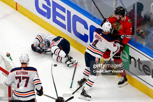 Tyler Ennis of the Edmonton Oilers is injured in a collision with Kirby Dach of the Chicago Blackhawks during the second period in Game Three of the...