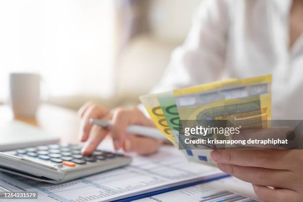 woman accounting ,money, euro - eu valuta foto e immagini stock
