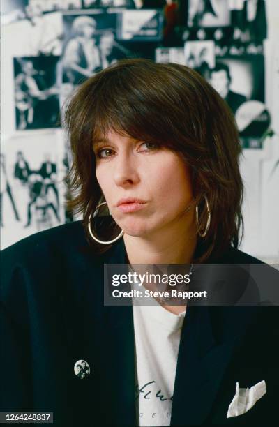 Portrait of American Rock musician Chrissie Hynde, of the group the Pretenders, at her management office in Kentish Town, London, circa 1986.