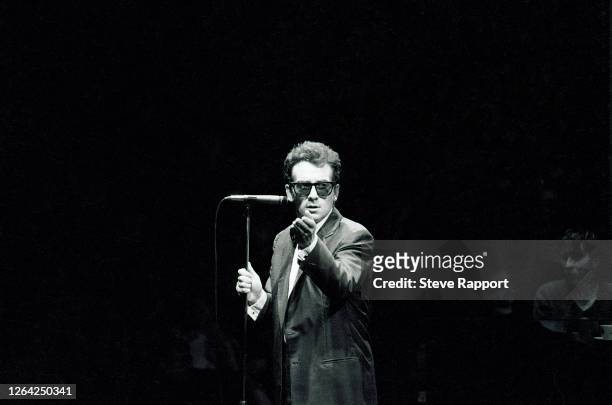 English New Wave & Pop musician Elvis Costello performs onstage, with the London Symphony Orchestra at the Royal Albert Hall, London, 1/7/1982.