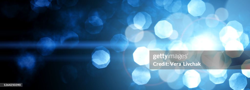 Defocused Lights - stock illustration. Blue Dusty Defocused Lights over Dark Backdrop. Christmas and New Year concept