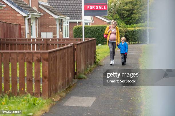 mother and son - house for sale uk stock pictures, royalty-free photos & images