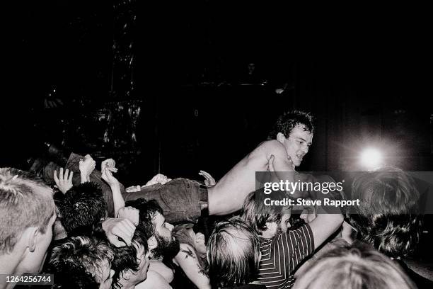 American Punk singer Jello Biafra, of the group Dead Kennedys, is carried aloft by the audience during a performance at The Lyceum, London, 10/4/1981.