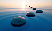 Stones in the ocean at sunrise
