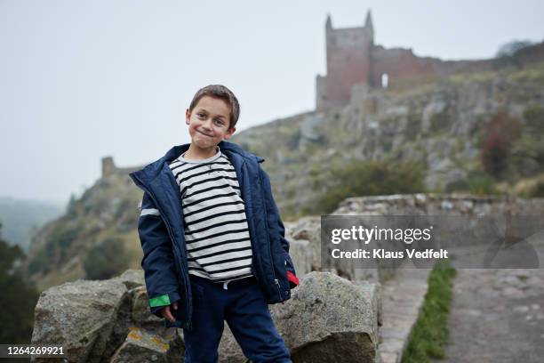 boy in jacket making face outdoors - bornholm stock pictures, royalty-free photos & images