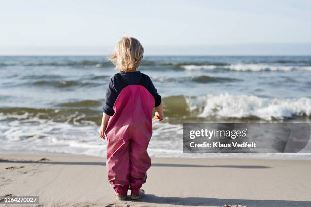 girl at beach during sunny day - bornholm island stock pictures, royalty-free photos & images