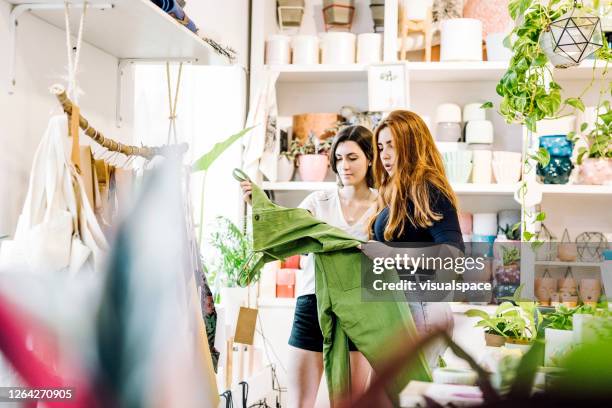 friends shopping in a gift shop - gift shop interior stock pictures, royalty-free photos & images