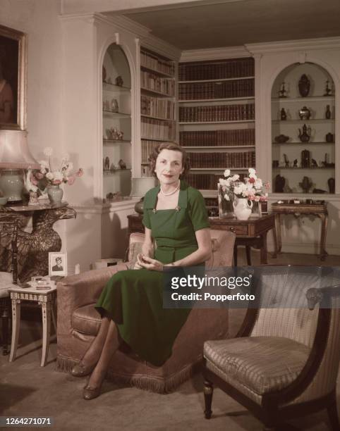 English heiress and socialite Edwina Mountbatten, Countess Mountbatten of Burma posed in the sitting room of her London home at number 2 Wilton...