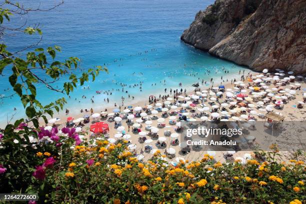 Citizens and tourists spend time at Kaputas beach during the Eid holiday to cool off in Antalya, Turkiye on June 27, 2023. Kaputas Beach, which was...