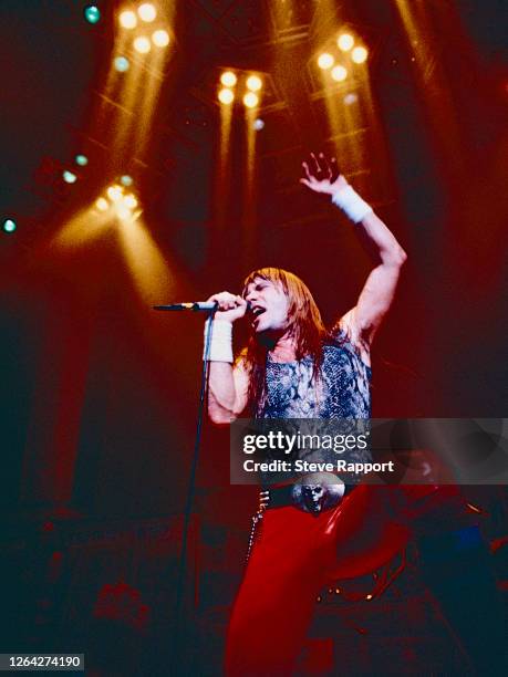 English Heavy Metal musician Bruce Dickinson, of the group Iron Maiden, performs during the band's 'World Slavery' tour, Royal Concert Hall,...