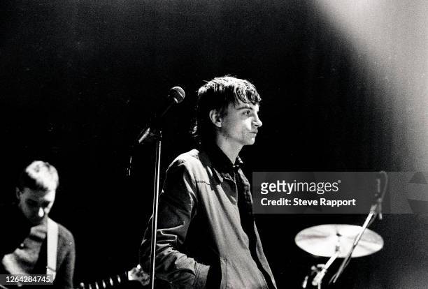 British Punk and Alternative musician Mark E Smith, of the group the Fall, The Venue, London, 12/7/1981. Visible in the background is guitarist Marc...