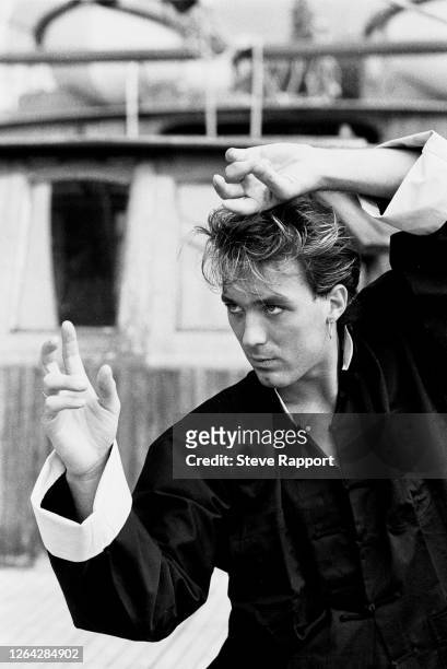 English New Wave and Synth Pop musician Martin Kemp, of the group Spandau Ballet, films the 'Highly Strung' music video, Hong Kong, 9/10/1984.